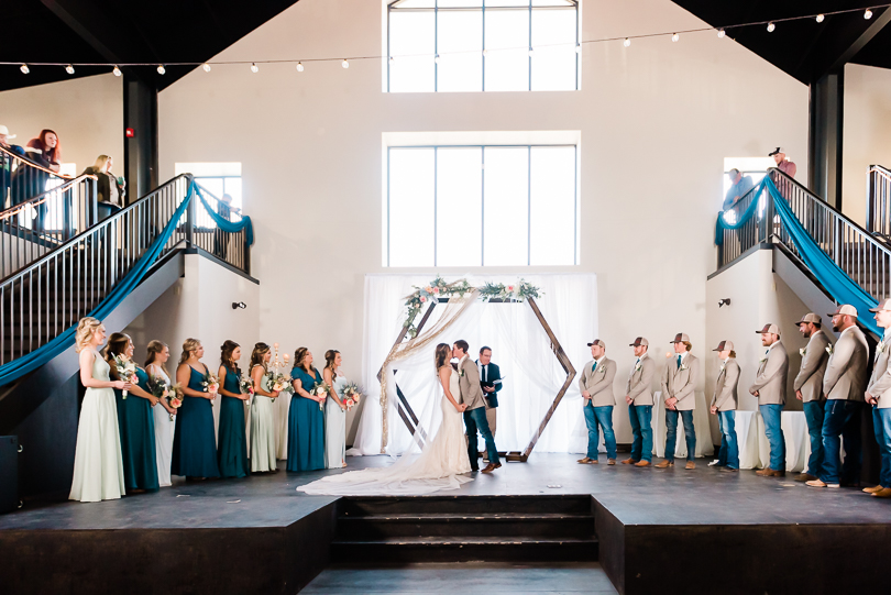 wedding ceremony on stage at capital bluffs event center