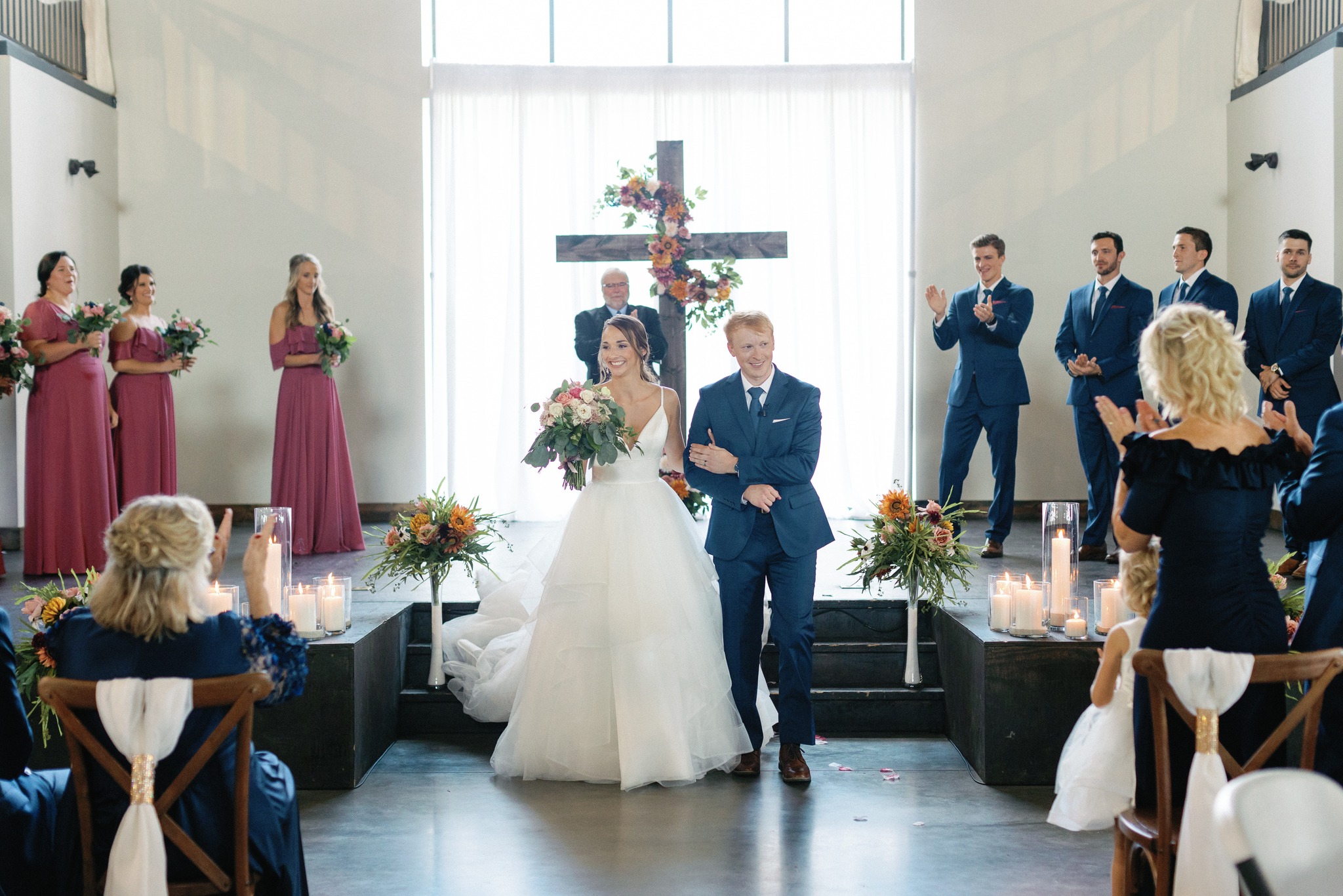 bride and groom walking down aisle