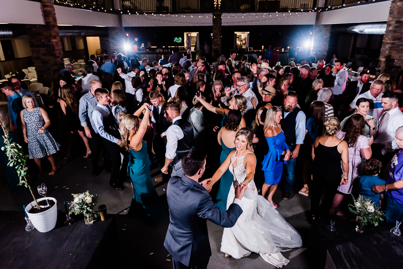 couple dancing with wedding guests