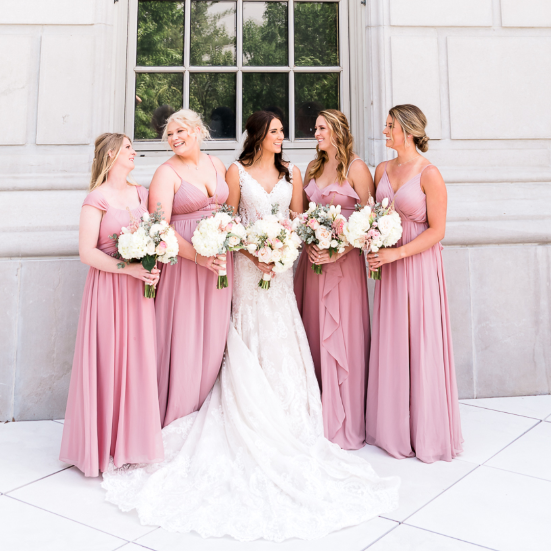 bride and bridesmaids in pink gowns