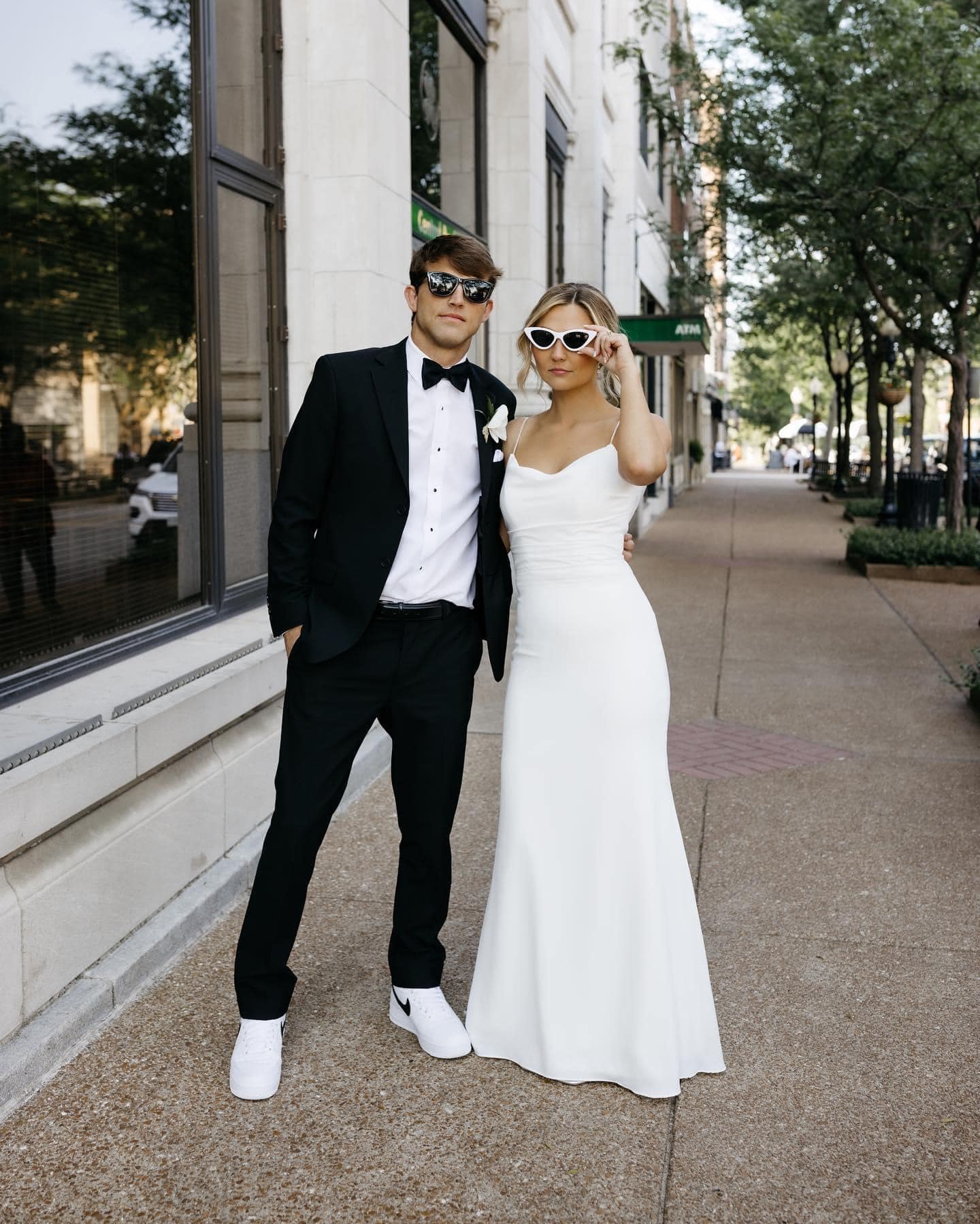 bride and groom wearing sunglasses