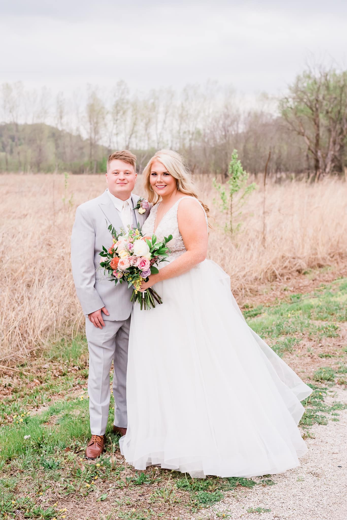 bride and groom posing outdoors