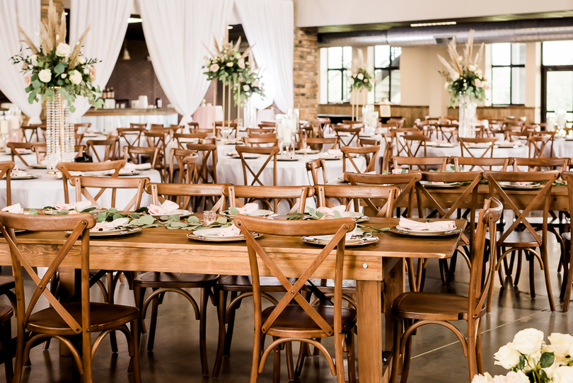 wooden wedding reception chairs and tables