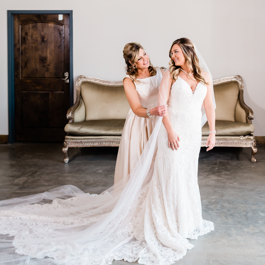 bride and mother of the bride smiling