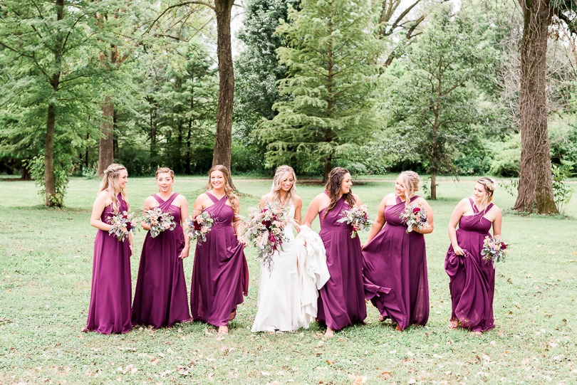 bride and bridesmaids walking outdoors