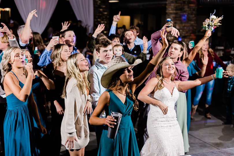 wedding guests dancing and singing