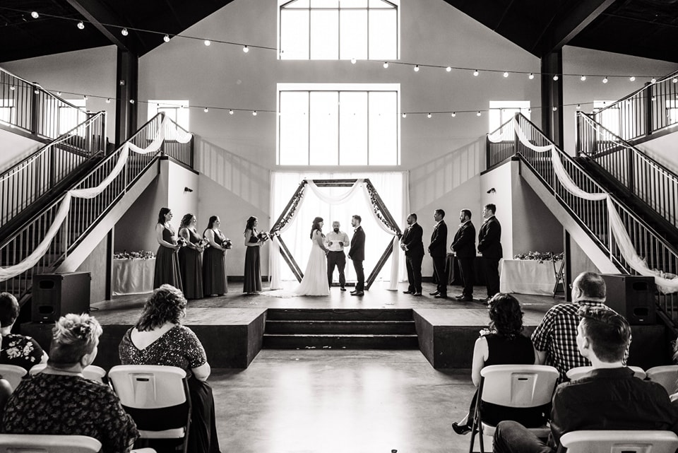 indoor wedding ceremony at at capital bluffs event center